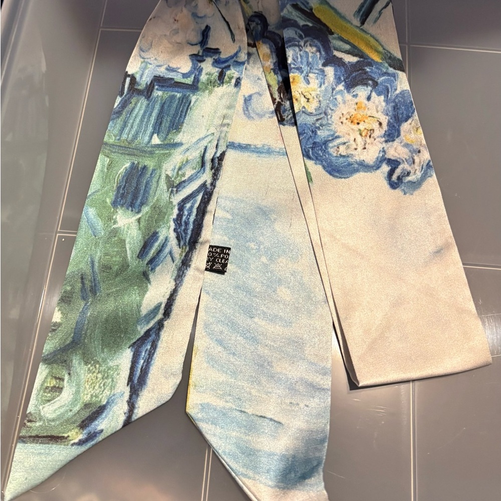 Elegant Floral Print Scarf That Is Tied into a Bow for Hanging On Your Purse.